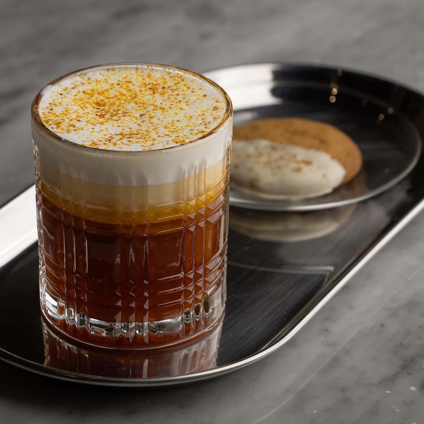 Bottles of olive standing on the marble counter